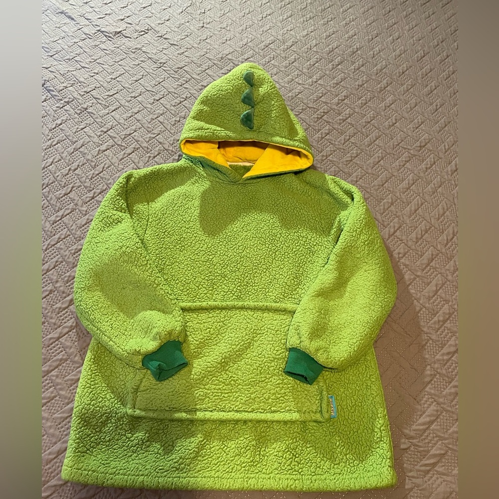 Green Huggle Pets Dinosaur hoodie. One size. Zips into plush dinosaur.